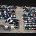 Numerous Various Colored Cars Parked In Outdoor Parking Lot With Different Models