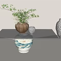 Glass Top Coffee Table with Green Vase Silver Vase and Potted Green Plants Decor