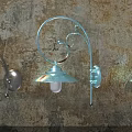 Decorative Metal Wall Lamps With Curved Design Mounted On Dark Wall