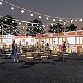 Commercial Outdoor Dining Area With String Lights Wooden Tables And People Enjoying