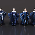 Women Modeling Blue Dresses With Large Pleated Skirts On Dark Reflective Floor