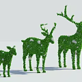 Green Shrub Deer Topiary Sculptures in Three Different Sizes with White Accents