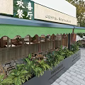 Joyful Restaurant Exterior With Green Awning Glass Windows Brick Walls And Potted Plants