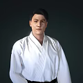 A Man in White Karate Uniform Standing Against Dark Background 3d model