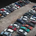 Parking Lot With Various Colored Cars Neatly Arranged In Rows