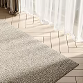 Textured Light Colored Square Rug on Herringbone Wooden Floor with Sheer Curtains and Natural Light