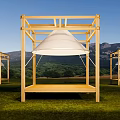Scenic Camping Site with Wooden Frame Structures White Canopy Green Grass and Mountain View