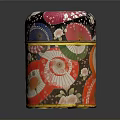 Colorful Patterned Cylindrical Storage Box With Traditional Floral Motifs And Decorative Bands