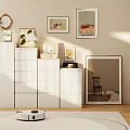 White Dresser In Bright Living Room With Sunlight And Decorative Items On Top