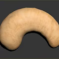 Whole Natural Cashew Nut with Smooth Surface Brown Color on Dark Background