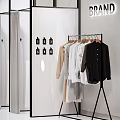 Modern Clothing Store With Fashion Clothes Hanging Rack Glass Door Wardrobe And Brand Sign