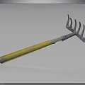 Garden Rake With Yellow Wooden Handle And Metal Tines Showing Reflection On Black Background