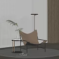 Elegant Modern Tan Leather Lounge Chair With Black Metal Frame Side Table And Floor Lamp