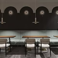 Modern Restaurant Interior With Hanging Lights Booths Tables Chairs Green Plants And Windows