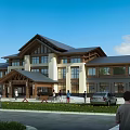Traditional Modern Office Building With Pitched Roof Wooden Accents Large Windows And Lawn Area