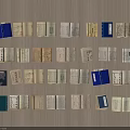 Old Books Neatly Arranged on Wooden Background with Multiple Open Pages and Blue Cover Books