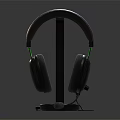 Black Over Ear Gaming Headphones With Comfortable Fit Green Accents Ergonomic Design On Stand