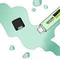 Fresh Green Cosmetic Product Bottle With Spilled Liquid Drops On Surface