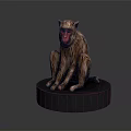 Detailed Monkey Sculpture Sitting On Black Base With Red Face And Brown Fur