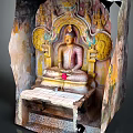Exquisite Seated Buddha Stone Sculpture Carved in Cave with Floral Motifs and Vibrant Colors