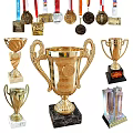 Golden Sports Trophies And Awards With Pedestal Base And Diverse Designs