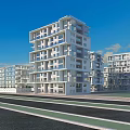 Modern White Multi Storey Residential Building With Large Windows And Balconies Under Blue Sky