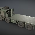 Green Military Truck with Flatbed Trailer Spare Tire on Top and Multiple Large Wheels