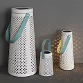 White Outdoor Lights With Perforated Dot Design And Blue Leather Handles Showing Light Shadow Effects