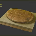 Freshly Baked Round Bread on Wooden Board with Golden Brown Texture