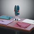 Traditional Dark Blue Coat On Mannequin With Green Purple Red Beige Fabrics On Wooden Platform