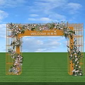 Welcome Arch with Yellow Frame Pink White Flowers Green Grass and Blue Sky