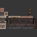 Dark Brown Tufted Sofa With Stacked Suitcases Wooden Boxes And Small Statue