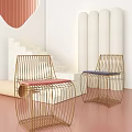 Modern Leisure Chairs With Metal Frame And Red Blue Cushions In Soft Tones Interior