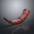 Handcrafted Red Brown Textured Horn Musical Instrument With Painted Art Details On Gray Backdrop