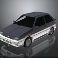 Vintage Gray And White Hatchback Car With Sleek Front Design And Sporty Wheels