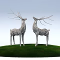 Silver Deer Sculptures Standing On Green Grass Against Light Blue Sky