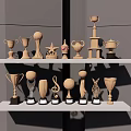 Trophies and Medals with Various Shapes Displayed on White Shelves