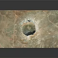 Aerial View Of Large Circular Meteor Crater In Desert Landscape With Central Depression And Surrounding Terrain