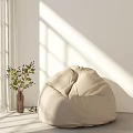 Beige Bean Bag Chair In Bright Room With Sunlight White Curtains And Green Plant
