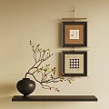 Two Decorative Frames Hanging On Wall With Artwork And Vase With Branches 3d model