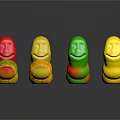 Colorful Gummy Worms With Red Yellow Green Smiley Face Shapes On Black Surface