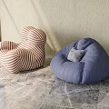Single Sofas With Orange White Stripes Blue Bean Bag And Gray Cushion On Marble Floor