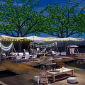 Scenic Camping Site With Wooden Deck String Lights Trees And Tents At Night