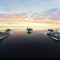 Aircraft Carrier Sailing On Ocean With Sunset Sky And Escort Ships