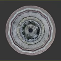 Circular Outdoor Fountain With Multi tiered Stone Structure And Pink Border