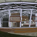 Modern Circular Detached Villa With Large Windows Steps To Entrance And Grassland Surroundings