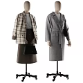 Mannequins Displaying Plaid Coat Gray Top Brown Skirt Gray Coat With Belt Black Bag Hanging Coats And Boots
