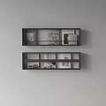 Black Wall Shelves Display With Magazines Photos And Artworks On Light Wall