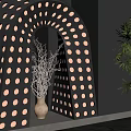 Black Interior Partition With Circular Holes Arched Opening Decorative Branches And Green Plant