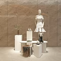 Clothing Store Interior Featuring Mannequin In White Dress Baskets Beige Walls And Tile Floor